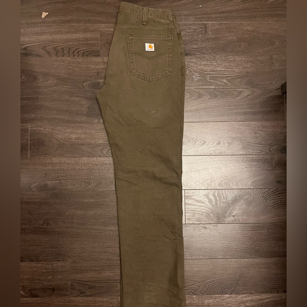 Carhartt work pants. Heavy-duty construction, ideal for workwear or casual wear